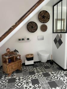 a bathroom with a staircase with a toilet in it at Chez TROTRO in Saint-Pierre-de-Plesguen +68 photos