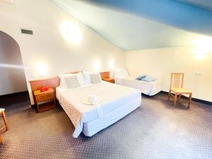 Postel nebo postele na pokoji v ubytování Hotel Bolognese