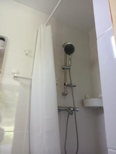 a shower curtain in a bathroom with a sink at Deleni Retreat - Glamping in Buzău +32 photos