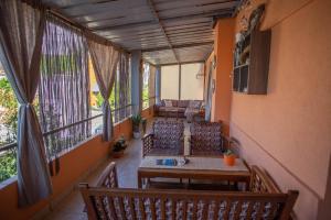 a balcony with chairs and a table in a building at Villa Rosa in Jelsa