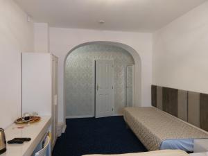 Postel nebo postele na pokoji v ubytování Hotel Jeleň