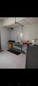 a large kitchen with a counter in a room at Mom House in Ipoh +10 photos