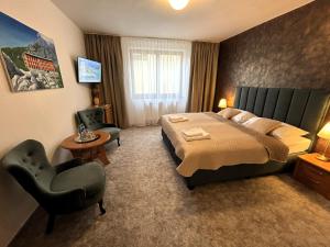 A bed or beds in a room at TATRANSKY DOM sk