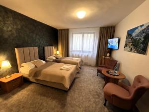 A bed or beds in a room at TATRANSKY DOM sk