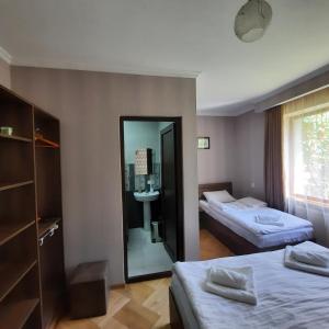 A bed or beds in a room at GIO-NIKA