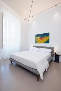 Postel nebo postele na pokoji v ubytování Piano Alloro