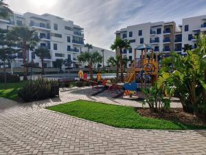 a playground with a slide at Martil Costa-Mar in Martil