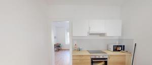 Η κουζίνα ή μικρή κουζίνα στο Jolie Appartement Meublé Audun-le-Tiche