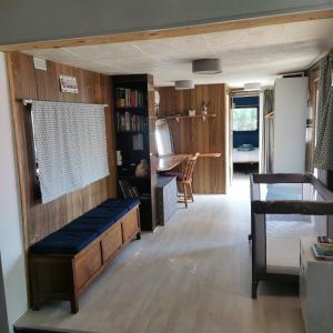 a living room with a couch and a table at Mobil home hors camping 7km de la mer in Roquebrune-sur-Argens