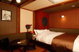 Postelja oz. postelje v sobi nastanitve HOTEL K's ABA Adult Only