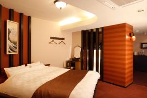 Postelja oz. postelje v sobi nastanitve HOTEL K's ABA Adult Only