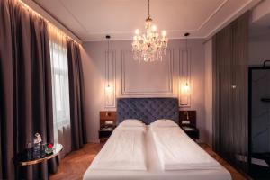 Posteľ alebo postele v izbe v ubytovaní BoutiqueHOTEL Donauwalzer