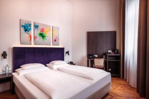 Posteľ alebo postele v izbe v ubytovaní BoutiqueHOTEL Donauwalzer