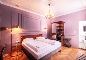Posteľ alebo postele v izbe v ubytovaní BoutiqueHOTEL Donauwalzer