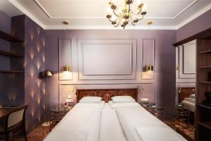 Posteľ alebo postele v izbe v ubytovaní BoutiqueHOTEL Donauwalzer
