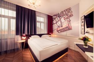 Posteľ alebo postele v izbe v ubytovaní BoutiqueHOTEL Donauwalzer
