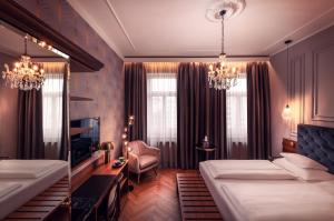 Posteľ alebo postele v izbe v ubytovaní BoutiqueHOTEL Donauwalzer