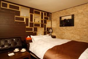 Postelja oz. postelje v sobi nastanitve HOTEL K's ABA Adult Only