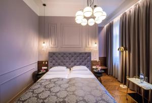 Posteľ alebo postele v izbe v ubytovaní BoutiqueHOTEL Donauwalzer