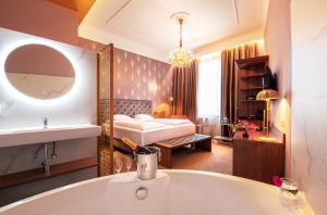 Posteľ alebo postele v izbe v ubytovaní BoutiqueHOTEL Donauwalzer