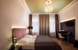 Posteľ alebo postele v izbe v ubytovaní BoutiqueHOTEL Donauwalzer
