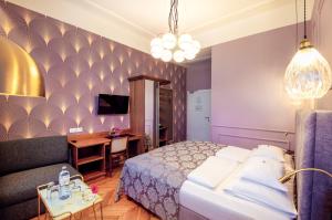 Posteľ alebo postele v izbe v ubytovaní BoutiqueHOTEL Donauwalzer