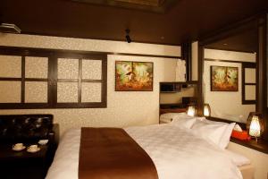 Postelja oz. postelje v sobi nastanitve HOTEL K's ABA Adult Only