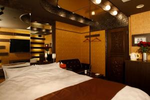 Postelja oz. postelje v sobi nastanitve HOTEL K's ABA Adult Only