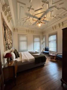 a bedroom with a bed and a coffered ceiling at Historical Greco-Ottoman Pavilion near Tram in Fatih in Istanbul