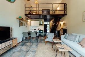 a living room with a couch and a table at Fajnové apartmány in Vyhne