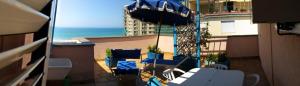 a view of a balcony with a view of the ocean at Residence Il Sole in Follonica