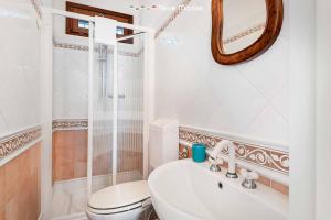a bathroom with a toilet and a sink and a shower at Terrazza Paradiso, TerreMarine in Monterosso al Mare +12 photos