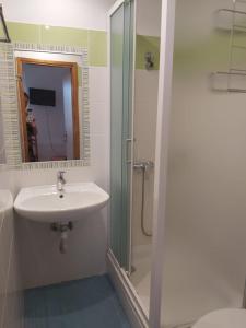 a bathroom with a sink and a shower at Villa Kate in Krk