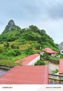 a view of a mountain with a red roof at Night Market Heart Hotel MC in Mộc Châu