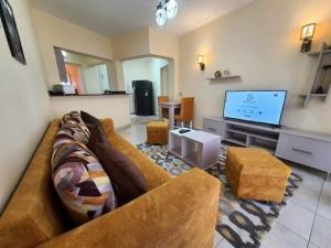 TV a/nebo společenská místnost v ubytování Delta Sharm Chalets