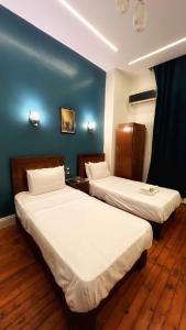 Voodi või voodid majutusasutuse Minerva Grand Hostel Cairo toas