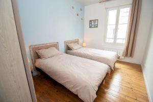 Giường trong phòng chung tại Gevelled, Maison de ville Perros