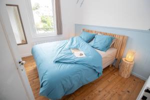 Giường trong phòng chung tại Gevelled, Maison de ville Perros +11 ảnh