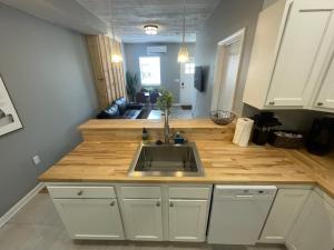 a kitchen with a sink and a counter top at The Yale Townhouse- 2 BR in Columbus