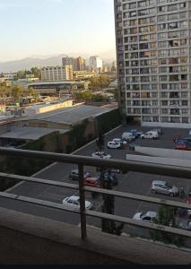 a parking lot with cars parked in a parking lot at Terminal Dpto Estación Central Equipado in Santiago