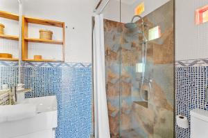 a bathroom with a shower and a sink at Canary casita next to the Atlantic Ocean in Radazul +34 photos