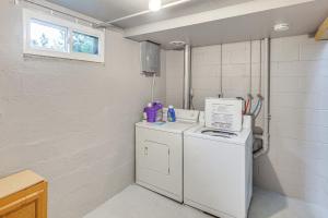 a laundry room with a washer and dryer at Cozy Sturgis Retreat - Walk to Main St and Saloons! in Sturgis +19 photos