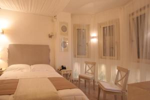 Letto o letti in una camera di Relais in Contrada