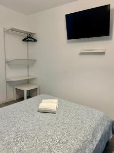 Μια τηλεόραση ή/και κέντρο ψυχαγωγίας στο Moreira Terrace +63 φωτογραφίες