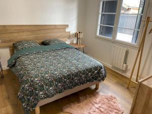 Postel nebo postele na pokoji v ubytování Portet - Appartement 4