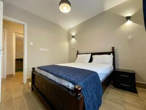 Katil atau katil-katil dalam bilik di Executive 3-Bed Apartment in Kitusuru Nairobi +42 gambar