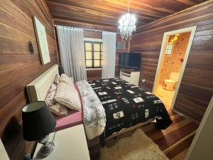 Ένα ή περισσότερα κρεβάτια σε δωμάτιο στο Casa Chalé na Serra Gaúcha