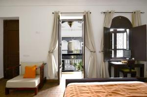 Uma cama ou camas num quarto em Riad Zoraida