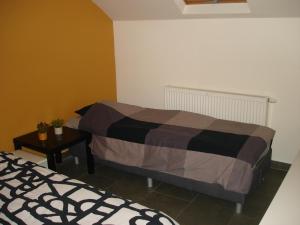 Postel nebo postele na pokoji v ubytování Appartement Courcelles