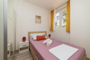 Ένα ή περισσότερα κρεβάτια σε δωμάτιο στο Apartman Angy